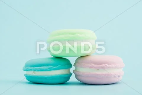 French Colorful Macarons Stacks On Pastel Background