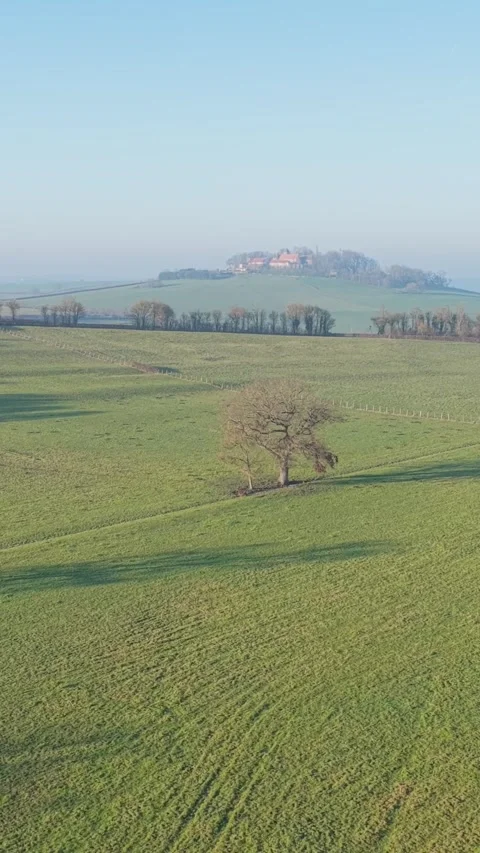 The French countryside in Nievre, featuring rolling green fields, scattered Stock Footage 346662671