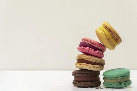 French crash macarons. Stack of macaron with dorblu and wine isolated on whit Stock Photos