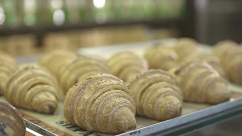 French crispy croissants closeup inside confectionery, slow motion Stock Footage 121963833