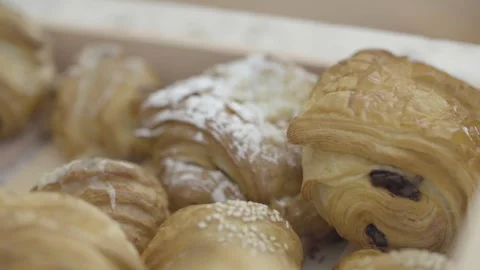 French crispy croissants closeup inside confectionery, slow motion Stock Footage 158055656