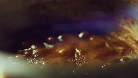 French dessert chocolate eclair. Pouring melted chocolate on eclairs Stock Footage 238994488