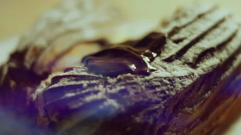 French dessert chocolate eclair. Pouring melted chocolate on eclairs Stock Footage 238994545