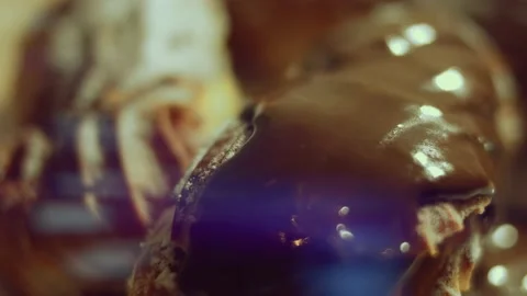 French dessert chocolate eclair. Pouring melted chocolate on eclairs Stock Footage 238994563