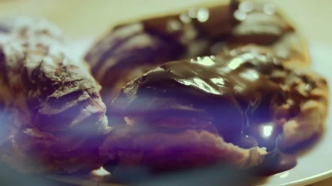 French dessert chocolate eclair. Pouring melted chocolate on eclairs Stock Footage 238994582