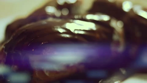 French dessert chocolate eclair. Pouring melted chocolate on eclairs Stock Footage 238994640