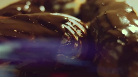 French dessert chocolate eclair. Pouring melted chocolate on eclairs Stock Footage 238994661