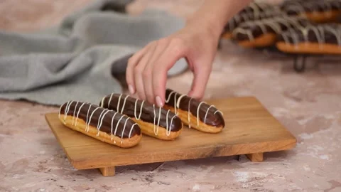 French dessert eclair with chocolate and custard. Traditional French dessert. Stock Footage 161705669