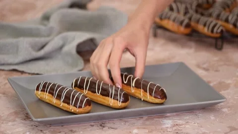French dessert eclair with chocolate and custard. Traditional French dessert. Stock Footage 162465907