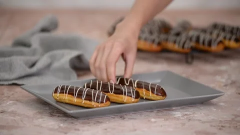French dessert eclair with chocolate and custard. Traditional French dessert. Stock Footage 163994994