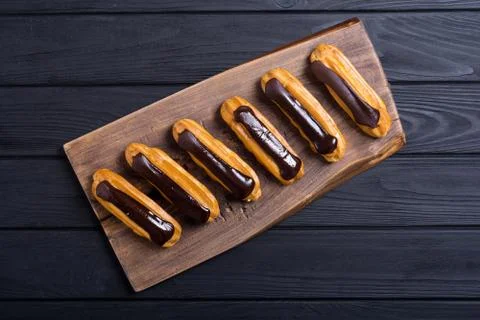 French dessert eclair with chocolate . Stock Photos