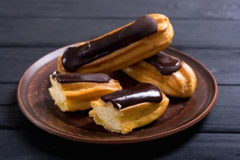 French dessert eclair with chocolate . Stock Photos