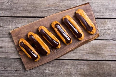 French dessert eclair with chocolate . Stock Photos