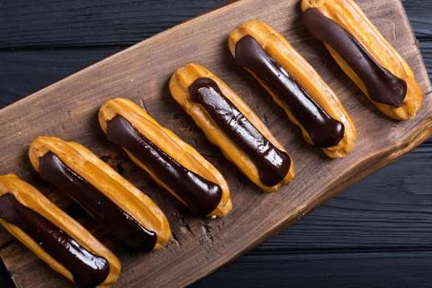 French dessert eclair with chocolate . Stock Photos