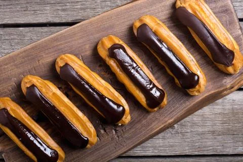 French dessert eclair with chocolate . Stock Photos
