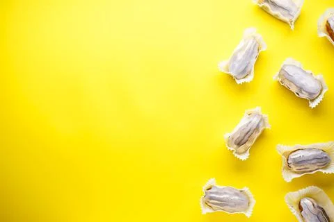 French dessert. Eclairs on a yellow background flat lay, place for text.  Hom Stock Photos