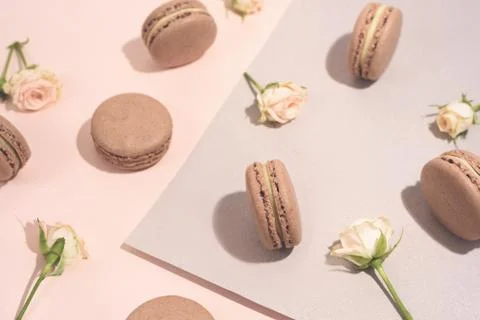 French dessert macarons pattern with rose flowers. Stock Photos