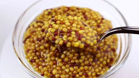 French dijon mustard sauce in the spoon close up Stock Footage 242515591