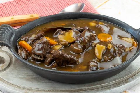 French dish " beef bourguignon " on a table Stock Photos