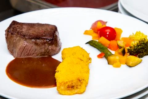 French dish breaded beef with vegetables and potatoes Stock Photos