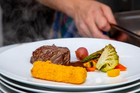 French dish breaded beef with vegetables and potatoes Stock Photos
