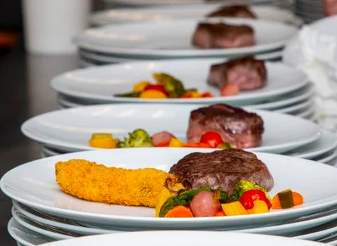 French dish breaded beef with vegetables and potatoes Stock Photos