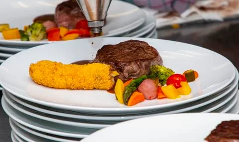 French dish breaded beef with vegetables and potatoes Stock Photos
