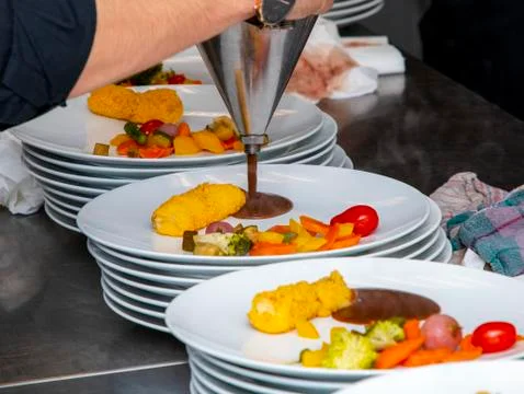 French dish breaded beef with vegetables and potatoes Stock Photos