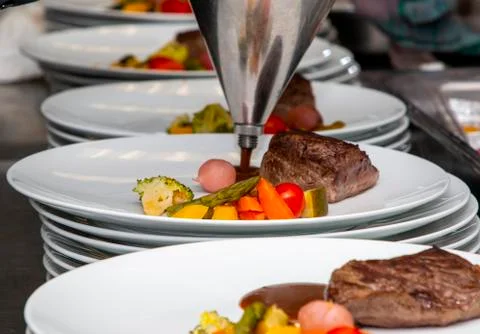 French dish breaded beef with vegetables watered with sauce Stock Photos