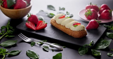 French Eclair Delicious pastry With Fresh Strawberries and Cream food Stock Footage 330104040