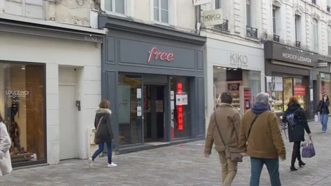 French facade with Logo of FREE mobile phone brand store shop in Le Mans, Stock Footage 147516058