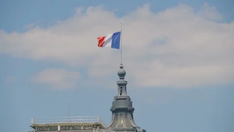 French flag on building waving in the wind in Paris, France Stock Footage 112033598