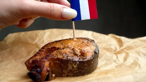 French flag on fish steak, symbol of local French coastal seafood. Stock Footage 323012805