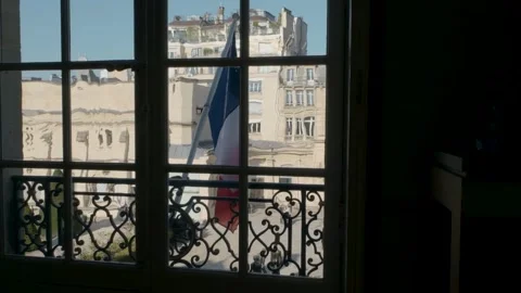 French flag floating outside a building in Paris on a summer day Stock Footage 274520690