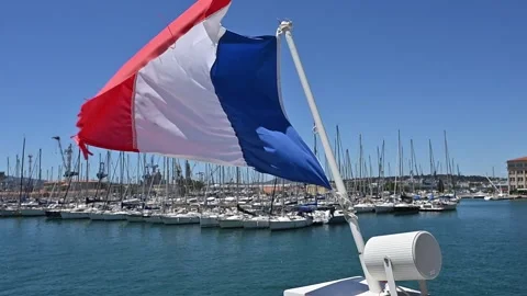 French flag flying off a boat Stock Footage 278170987
