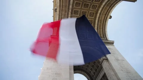 French flag flying under the Arc de Triomphe in Paris, France - T/Lapse Video stock 7722346