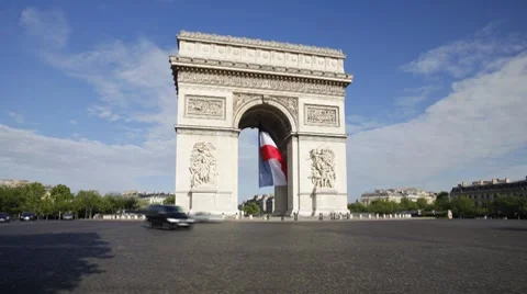French flag flying under the Arc de Triomphe in Paris, France - T/Lapse Stock Footage 7723173