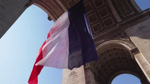French flag flying in the wind under the Arc de Triomphe - Paris, France Video stock 155366776