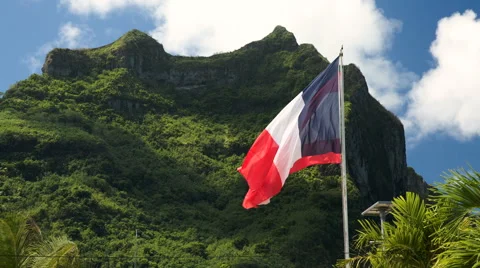The french flag in front of the mountain in Bora Bora, French Polynesia Stock Footage 65712656