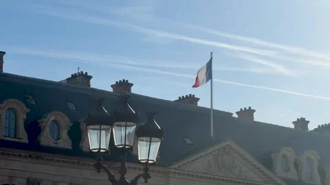 French flag midday over ornate palace lively editorial shot Stock Footage 337185251