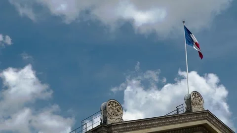 The French Flag over Gare Du Nord in Paris 4k Stock Footage 244884419