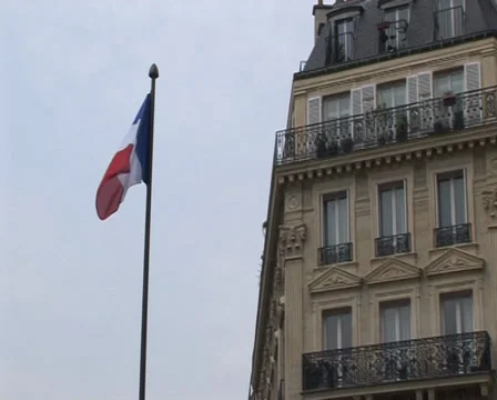 French flag, pan down to street scene in Paris, France Stock Footage 35776795