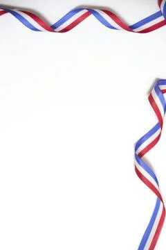 French flag ribbon twisted on white background in a design with copy space. Stock-Fotos