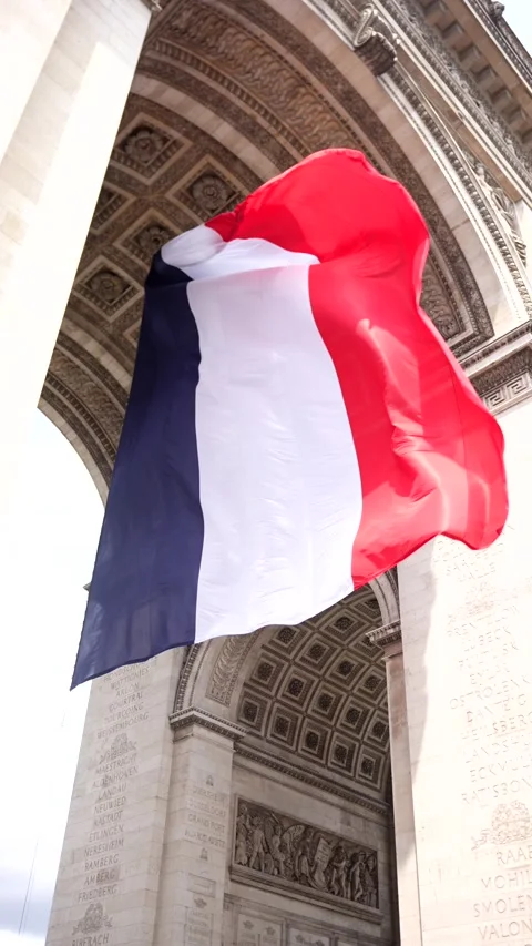 French flag under Arc de Triomphe in Paris 2025 Stock Footage 311064092