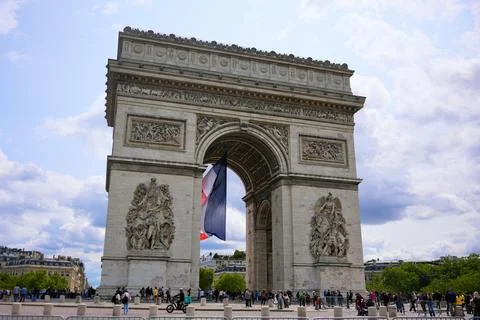 French flag under Arc de Triomphe in Paris, France on June 4 2025 Stock Photos
