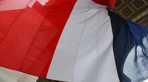 French Flag under Arch de Triumph during Victory Day celebration in Paris France Vidéo 29168750