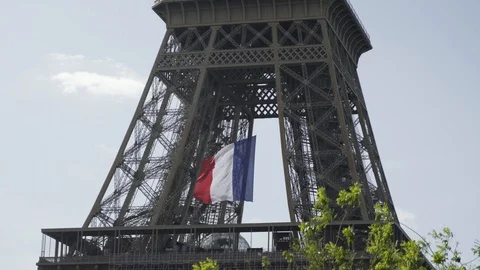 French flag waving on Eiffel tower during coronavirus quarantine 4K Stock Footage 130145564
