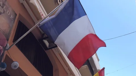 French flag waving on the facade of a building Stock Footage 117838452