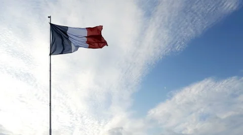 French flag waving in front of a nice cloudy sky in slow motion Stock Footage 65826967