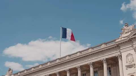French flag waving over historic building in Place de la Concorde, 4K Stock Footage 344972548
